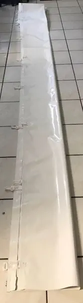 White rolled-up sheet on tile floor