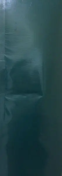 Close-up of creased dark material
