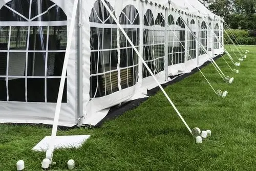 Large white event tent on grass
