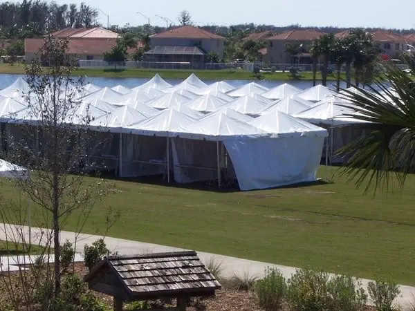 Outdoor event tents near lake