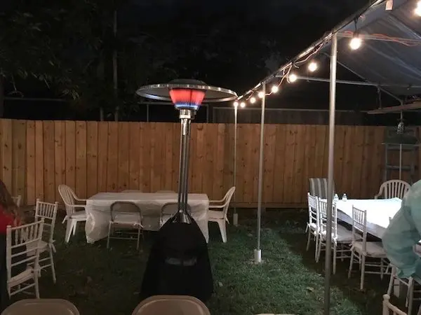 Backyard setup with tables and chairs
