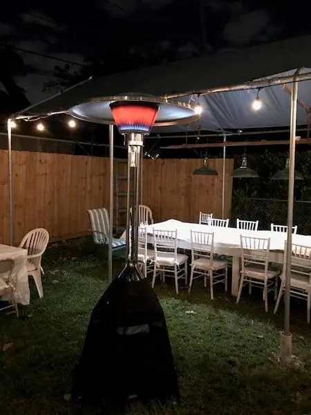 Outdoor patio with heater and chairs