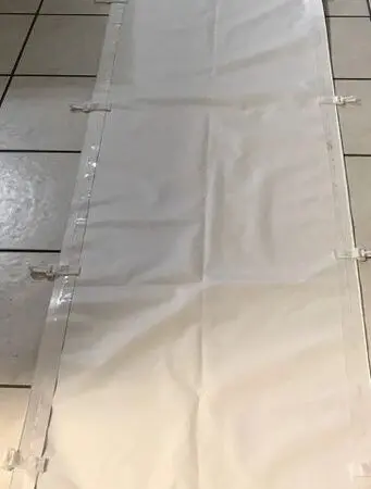 White fabric laid on tiled floor