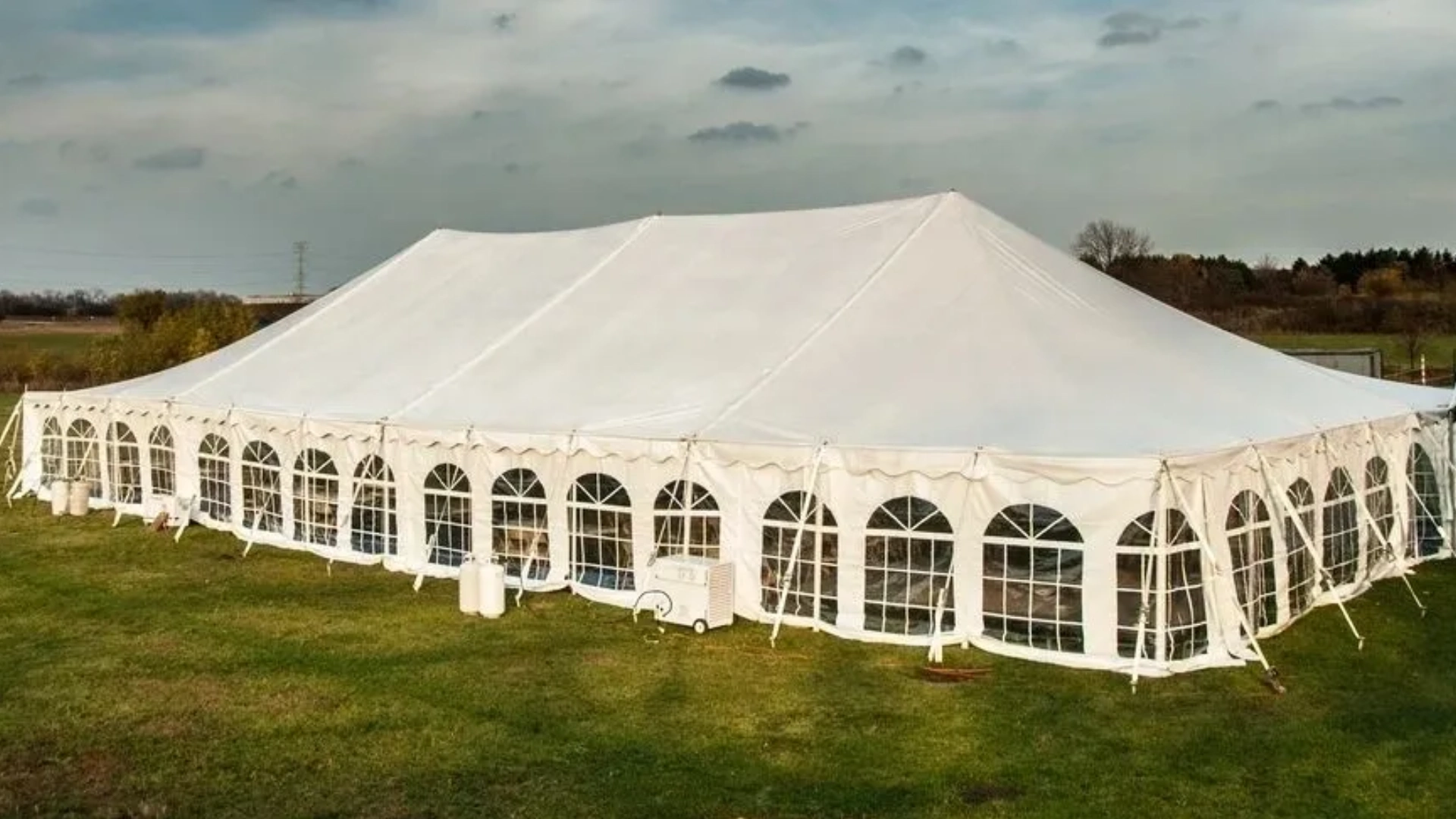 Outdoor wedding reception tent setup