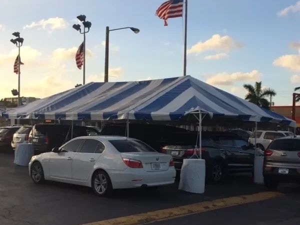 Blue and white tent at car dealership