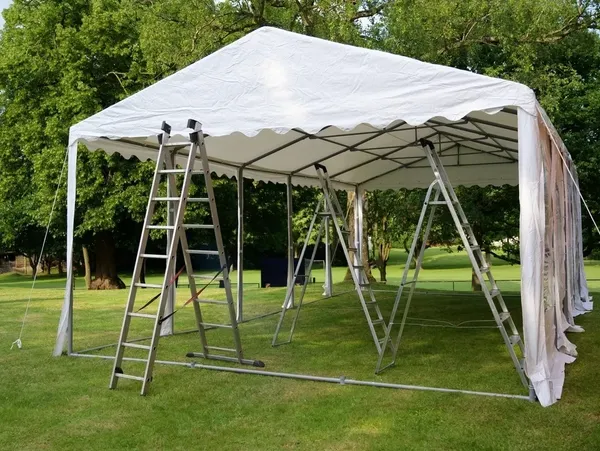 White event tent setup outdoors