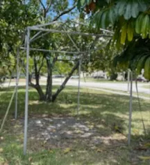 Empty tent frame on grass