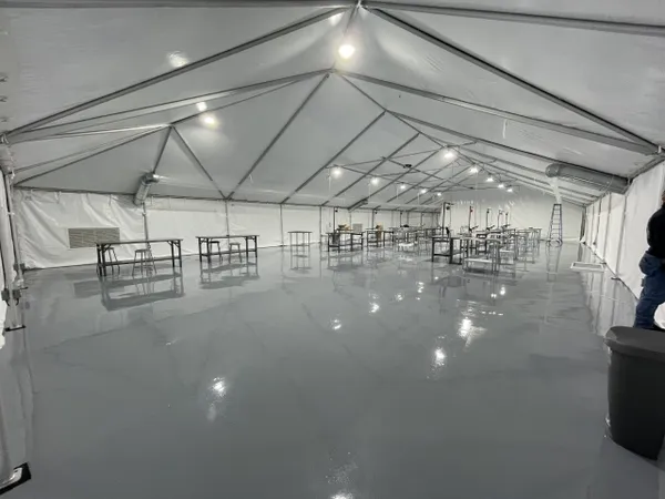 Spacious event tent with bright lighting