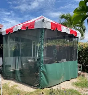 Patio tent with striped roof and sides