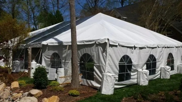 White outdoor event tent with windows