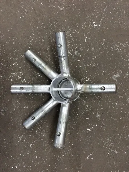 Silver pipe fitting with six extensions.