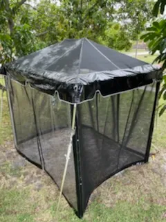 Small black gazebo among trees