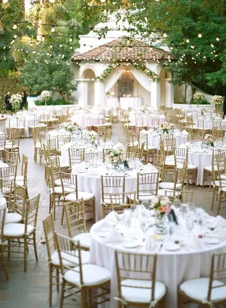 Outdoor wedding reception with elegant table settings