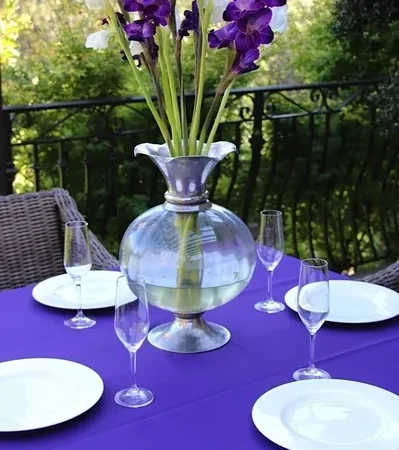 Outdoor dining table with floral centerpiece
