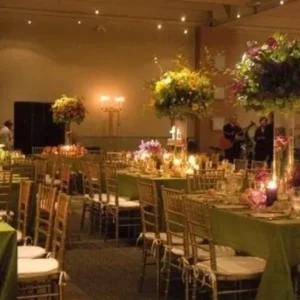 Candlelit dining tables at a formal event