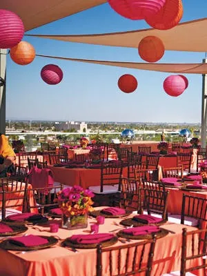 Vibrant party setting with orange and pink decor