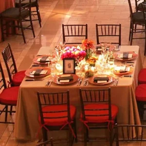 Dinner table with red cushioned chairs