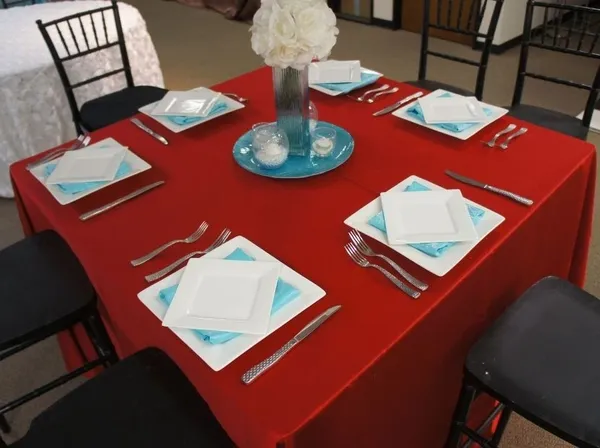 Square table with white plates setup