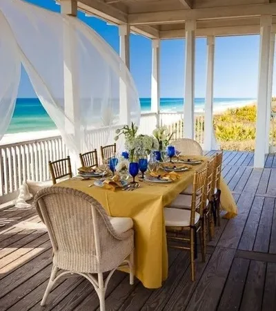 Beachside dining with flowing white curtains