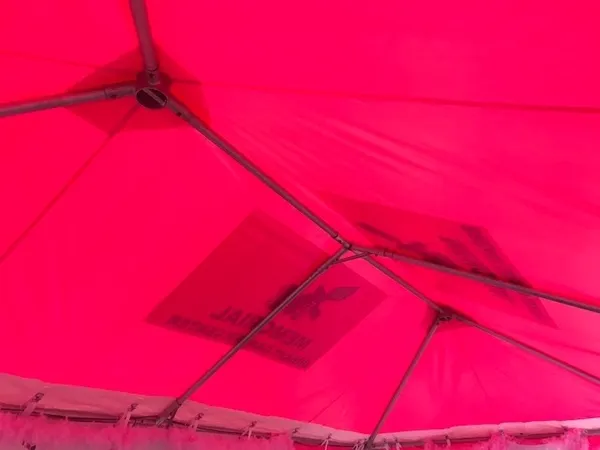 Red tent ceiling with metal framework
