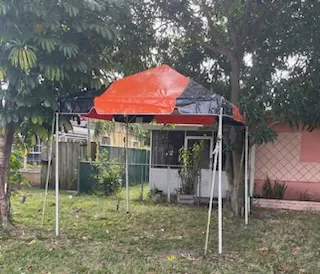 Orange and black canopy in backyard