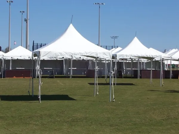 White tents set up on grass