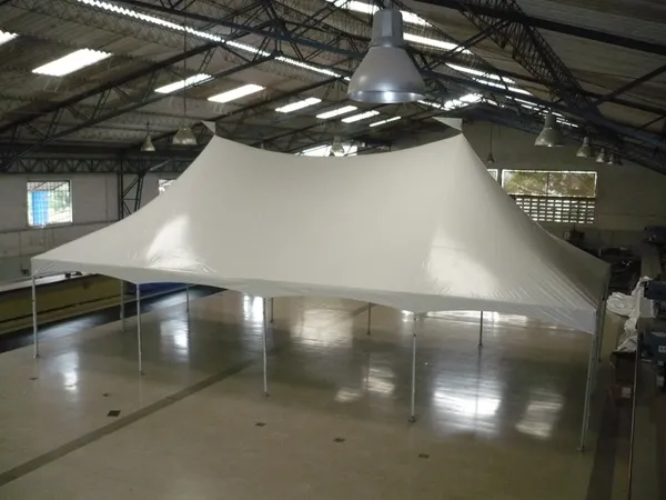 Spacious warehouse interior with white canopy