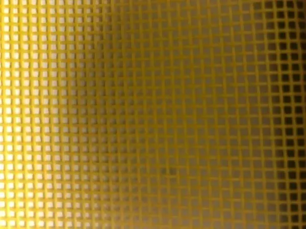 Yellow mesh fabric close-up