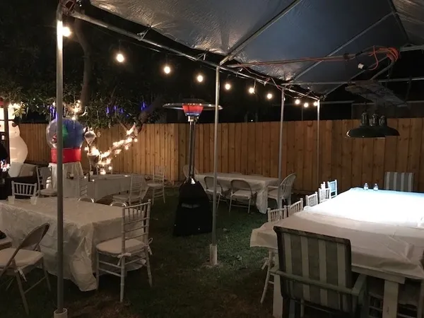 Outdoor party setup with string lights