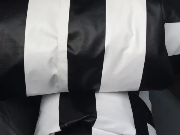 Folded black and white striped fabric