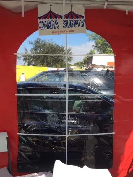 Red tent window with outdoor reflection