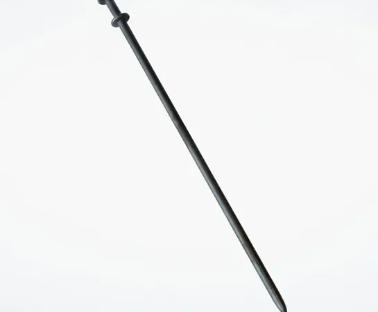 Metal spike for railway tracks
