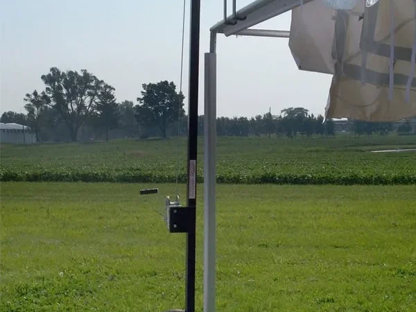Outdoor canopy setup in grassy field
