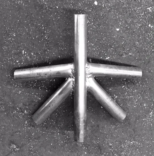 Industrial metal pipe arrangement on concrete