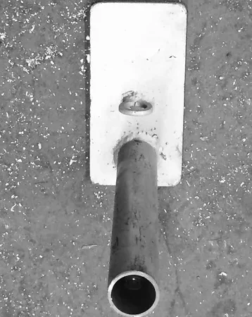 Steel tube on textured ground