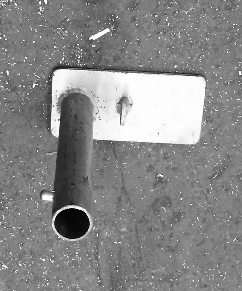 Industrial pipe on gritty floor