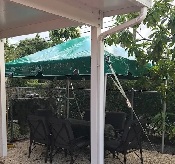 Outdoor seating under green canopy