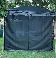 Portable canopy set up in yard