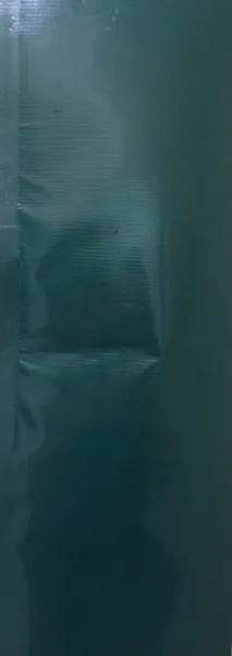 Wrinkled green plastic sheet