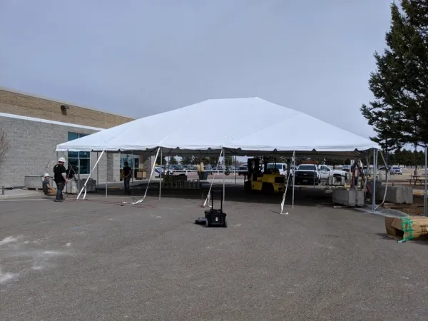 White tent in parking lot
