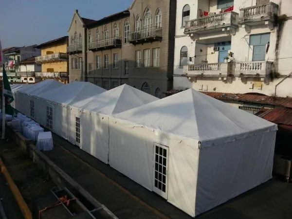White tents along urban street