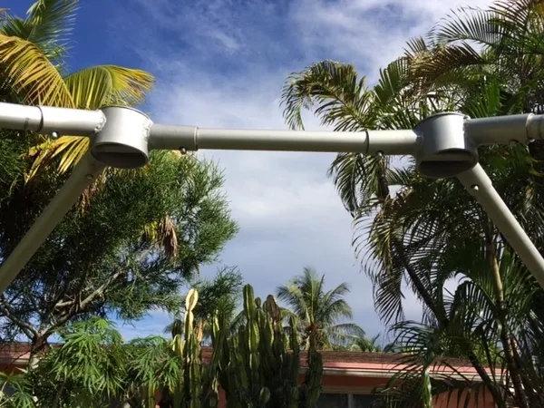 Outdoor metal frame and palm trees