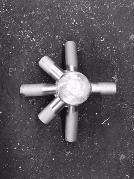 Steel pipe fitting on concrete floor