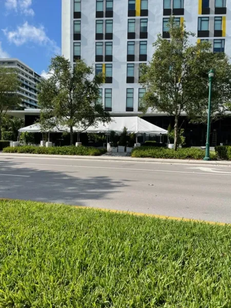Tall building with trees and grass