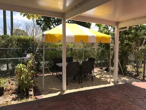 Garden table set under a canopy