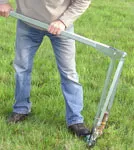 Man operating soil testing equipment
