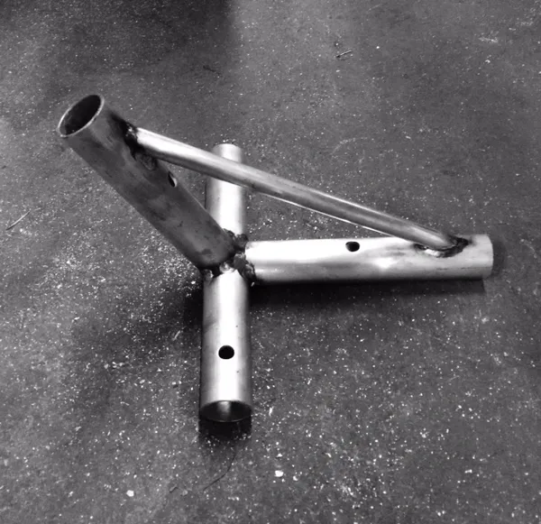 Metal pipe structure on concrete floor