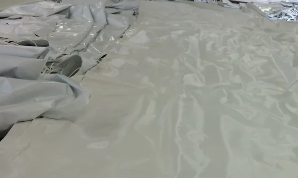 Wrinkled plastic material spread out