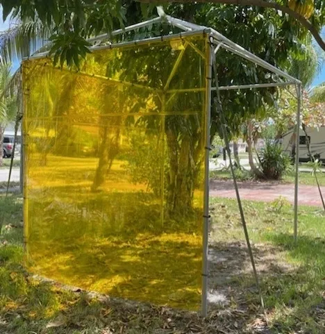 Temporary shade structure with yellow cover
