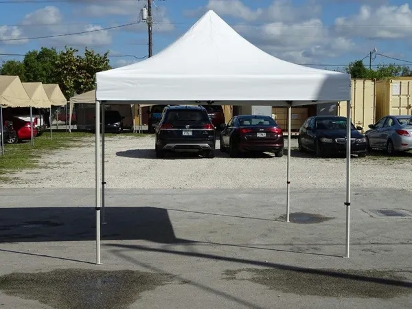 White outdoor canopy setup in parking lot